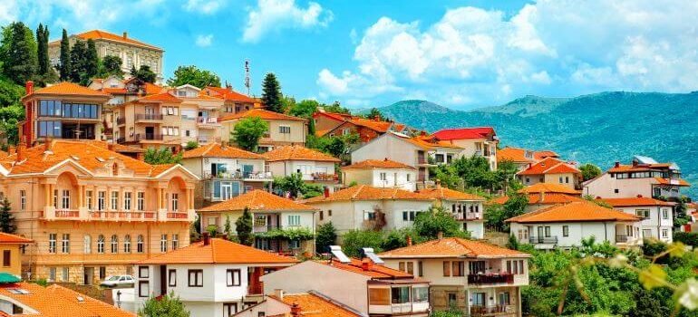 Different buildings and houses with red roofs on hill Ohrid North macedonia.