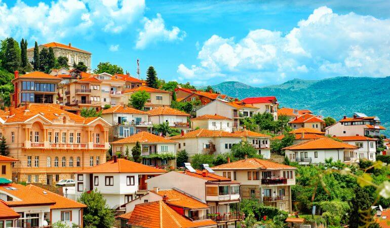 Different buildings and houses with red roofs on hill Ohrid North macedonia.