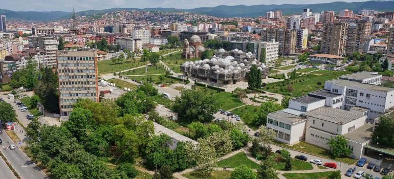 Aerial view of the capital city Pristina with some old buildings like National Public Library and Christ the Saviour Cathedral