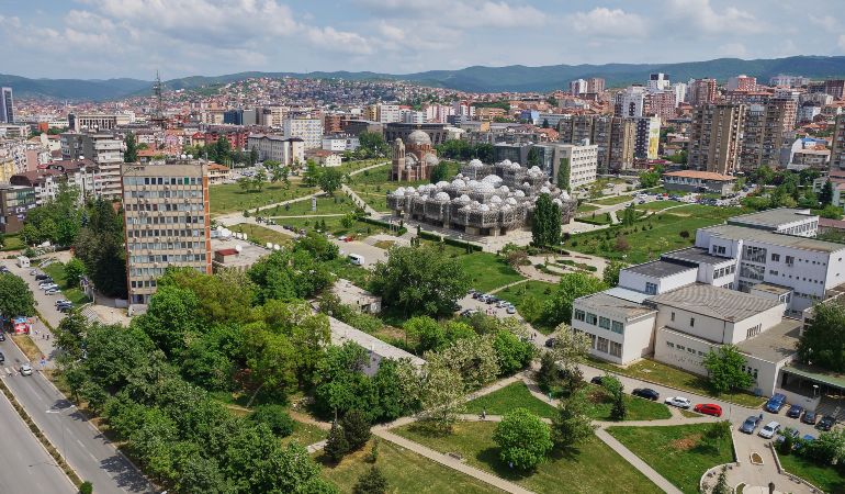 Aerial view of the capital city Pristina with some old buildings like National Public Library and Christ the Saviour Cathedral