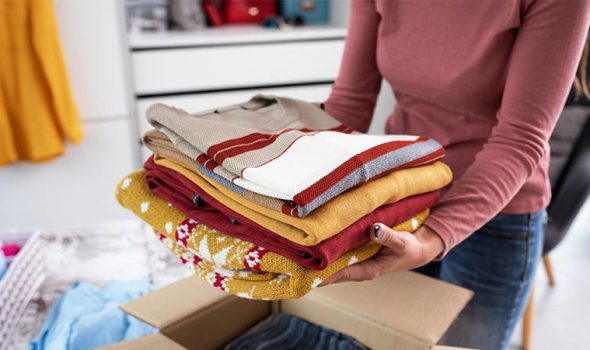 Packing Clothes in a Box for a Move