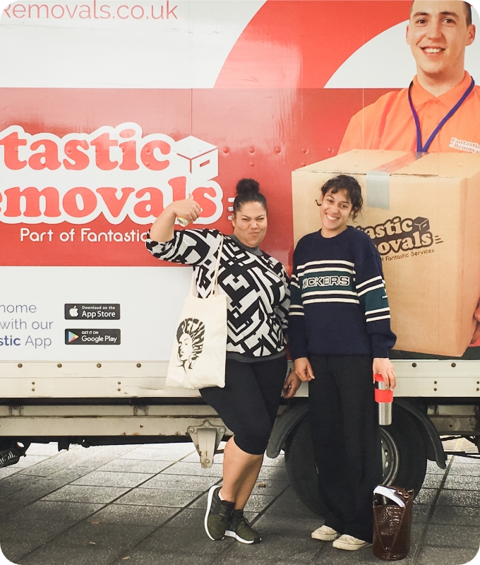 The image shows a couple of Fantastic Removals happy customers who are standing next to a van.