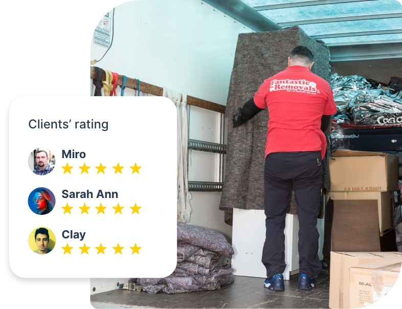 The image shows a Fantastic Removals specialist who is loading a van with furniture.